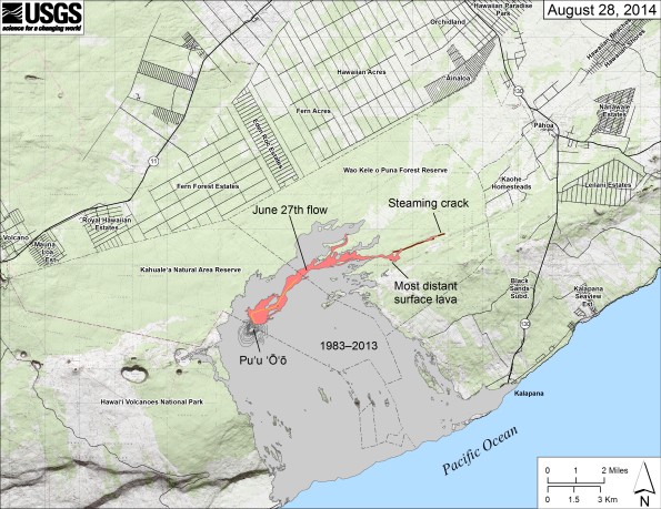 Map showing the June 27th flow in Kīlauea’s East Rift Zone as of August 28, 2014. The area of the flow as mapped on August 27 is shown in pink, while widening and advancement of the flow as of August 28 is shown in red. All older lava flows (1983–2014) are shown in gray. The thin yellow line marks a portion of the lava tube feeding the flow. The only place where lava significantly widened the margin was at the most distant surface breakout, which was 8.6 km (5.3 miles) from the vent. The brown line at the far end of the flow marks the ground crack that channeled lava to the east, where it later emerged to form a new pad of lava. Yesterday, there was no surface activity there and no indication that lava was continuing to advance within ground cracks. This morning, however, steam was rising above a crack extending east beyond the end of the lava pad, suggesting that lava was once again advancing within a crack below ground. The most distant steaming area was 11.9 km (7.4 miles) from the vent and 2.6 km (1.6 miles) from east boundary of the Wao Kele o Puna Forest Reserve.