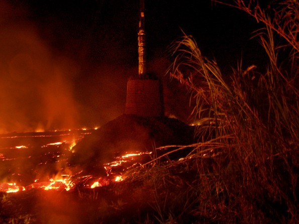 A HELCO utility pole which was hardened against the onslaught of the lava flow appears to be surviving Saturday (Oct 25). Photo courtesy of HELCO
