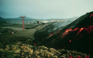 Thirty feet (10 m) thick aa flow approaching the Sapienza barrier at Mount Etna. The flow add a layer about 6 feet (2 m) thick to the top of the barrier but did not go beyond. Photograph by Jack Lockwood, U.S. Geological Survey, May 28, 1983.