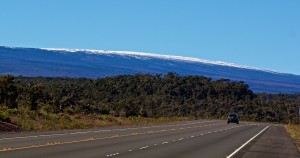 The snow-capped Mauna Loa and the Daniel K. Inouye Highway Sunday, January 4, 2014. Photography by Baron Sekiya | Hawaii 24/7