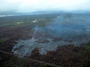 Photo from the Tuesday morning (Feb 24) overflight showing the north margin breakout. This photo is looking downslope with Pahoa in the background. Photo courtesy of Hawaii County Civil Defense