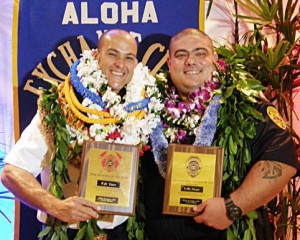 Fire Prevention Inspector Kyle Vares and Vice Officer Kelly Moniz display plaques from the Aloha Exchange Club of East Hawaiʻi.