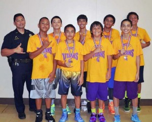 Waiākea Titans Gold: Front row, from left—Shesley Martines, Guyson Ogata, Kiaʻi Apele, Mikey Bugado. Back row—Officer Ryan Domingo, Rekky Prudencio, Magnus Namohala-Roloos, Kawai Kiko, Kilohana Haasenritter
