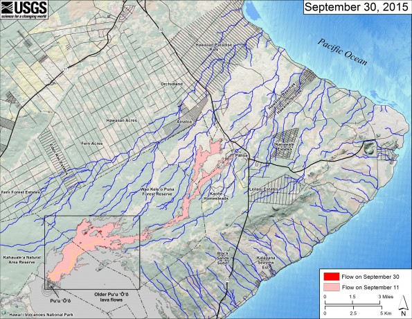 This small-scale map shows Kīlauea’s active East Rift Zone lava flow in relation to the eastern part of the Island of Hawaiʻi. The area of the flow on September 11 is shown in pink, while widening and advancement of the flow as of September 30 is shown in red. The yellow lines show the active lava tube system. Puʻu ʻŌʻō lava flows erupted prior to June 27, 2014, are shown in gray. The black box shows the extent of the accompanying large scale map. The blue lines show steepest-descent paths calculated from a 1983 digital elevation model (DEM; for calculation details, see http://pubs.usgs.gov/of/2007/1264/). Steepest-descent path analysis is based on the assumption that the DEM perfectly represents the earth's surface. DEMs, however, are not perfect, so the blue lines on this map can be used to infer only approximate flow paths. The base map is a partly transparent regional land cover map from National Oceanic and Atmospheric Administration (NOAA) Office of Coastal Management draped over the 1983 DEM. The bathymetry is also from NOAA. Because the flow field is changing very little at the moment, mapping of the lava flow is being conducted relatively infrequently. We will return to more frequent mapping if warranted by an increase in activity.