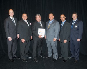 CALEA Executive Director W. Craig Hartley Jr., Lieutenant Kenneth Quiocho, Deputy Chief Paul Ferreira, Sergeant Tuckloy Aurello, Sergeant Regino Saludares and CALEA Commission Chairman Mr. Richard Meyers pose in Miami on Nov. 21 after the Hawai'i Police Department earns reaccreditation.
