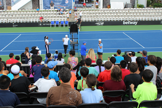 Team captain Mary Joe Fernandez gives a pep talk before nearly 80 young players were treated to a hitting session with members of Team USA. Dozens of players from little tykes to high school stars were invited to line up against the pros and get a few playing tips, followed by an opportunity for photos and capped with a pizza party. (Hawaii 24/7 photo by Karin Stanton)