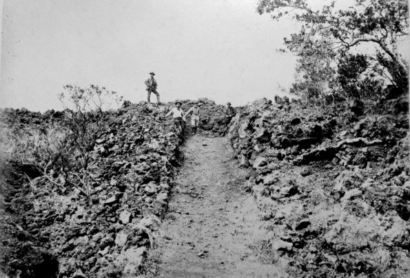 The 1887 lava flow erupted from Mauna Loa’s Southwest Rift Zone crossed the government road (about a 1,000 feet south of today’s Highway 11), traveling 14 km (9 mi) in less than 9 hours. Photo by J.J. Williams, courtesy of National Park Service.