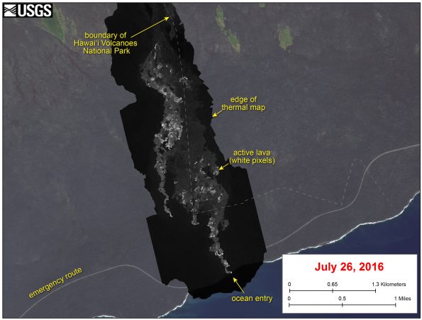 This image shows a thermal map of the flow on the pali and coastal plain, created from airborne thermal images. White pixels are hot, and show areas of active surface breakouts. The background image is a satellite image collected before the current lava flow was active. The thermal map shows scattered pāhoehoe breakouts on the coastal plain, with a narrow lobe of lava crossing the gravel road and extending to the ocean. In addition, a narrow lobe was advancing along the western margin of the flow on the coastal plain.