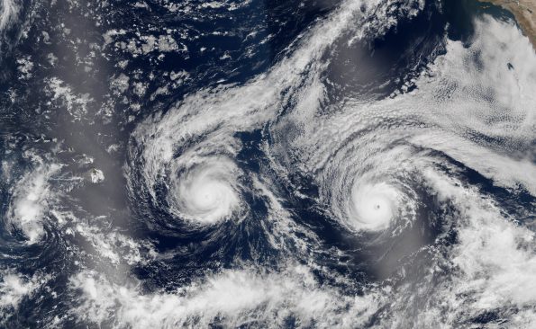 The natural-color image above is a composite built from two overpasses by the Visible Infrared Imaging Radiometer Suite (VIIRS) on the Suomi NPP satellite on August 29, 2016. At the time, Hurricane Madeline and Hurricane Lester were both hovering between category 3 and 4 storms. The bright streaks across the ocean surface (crossing Hawaii and Lester) are areas of sunglint, where sunlight reflected directly back at the VIIRS imager.