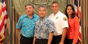Deputy Police Chief Paul Ferreira, Gov. David Ige, Fire Chief Darren J. Rosario, Rep. Tulsi Gabbard in Honolulu at the launch of the Text-to-911 service. Photo courtesy Office of the Governor.