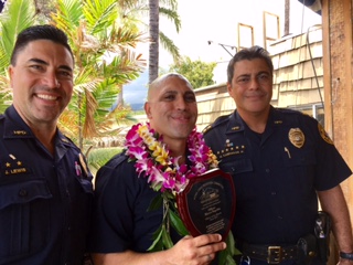 Photo is at Huggo’s with Detective Scotty Lewis, Officer Segobia, and Assistant Chief Mitchell Kanehailua, (June 7) Photo: Courtesy of Sherry Bracken