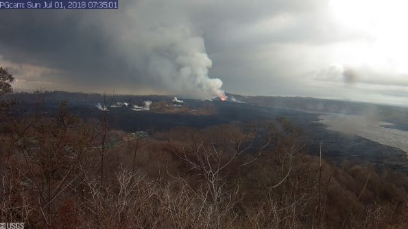 This image is from a temporary research camera positioned near Kapoho looking southwest. From left to right, one can see the eruptive fissures, with Fissure 15 on the far left, and Fissure 8 near the center. Webcam image taken Sunday, July 1, 2018 courtesy of U.S. Geological Survey