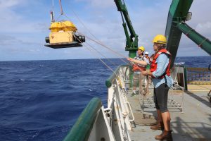 University students assisted with deployment of ocean-bottom seismometers off the south coast of Kīlauea Volcano from the deck of the R/V Ka`imikai-o-Kanaloa, a 223-foot research vessel operated by the University of Hawai‘i, on July 10, 2018. Photograph courtesy of Jackie Caplan-Auerbach, Western Washington University.