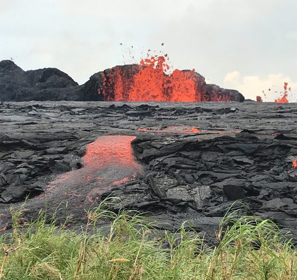 When Kīlauea Volcano’s lower East Rift Zone first erupted on May 3, 2018, lava temperatures were about 2000 degrees Fahrenheit. As the eruption progressed, with fresher magma feeding the fissures, the erupted lava became progressively hotter, resulting in more fluid and far-reaching lava flows (May 21 shown here). Lava temperatures have now leveled out at 2070–2085 degrees Fahrenheit. These temperature measurements provide insight on what’s happening inside the volcano. USGS photo by C. Parcheta.