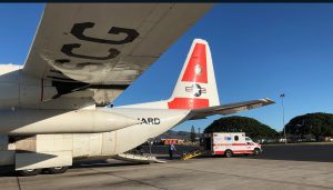 A Coast Guard HC-130 Hercules aircrew delivers a 35-year-old man suffering from sepsis in Hilo, Hawaii, Feb. 20, 2019. The aircrew worked jointly with the Hawaii Disaster Medical Assist Team to medevac the man quickly to a higher level of medical care. (U.S. Coast Guard photo by Lt. Eric Ferree)