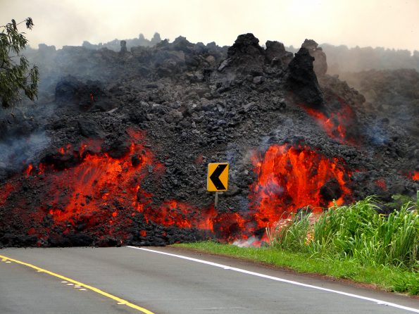 This ‘a‘ā flow erupted from fissure 8 on Kīlauea Volcano’s lower East Rift Zone on June 1, 2018, shows how the interior of a lava flow remains incandescently hot even though surface cooling forms a crust of solid rubble. Based on studies of lava flow cooling rates, it will take more than 130 days for a flow this thick (about 4.5 m, or 15 ft) to cool to a temperature of about 200 degrees Celsius (290 degrees Fahrenheit). USGS photo by A. Lerner.