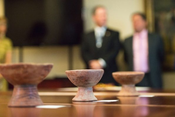 Dozens of Colombian artifacts recovered by the FBI were repatriated during a ceremony in October 2018 at the Colombian Embassy in Washington, D.C. Seen in the background are FBI Special Agent Max Marker and Colombian Ambassador H.E. Francisco Santos. FBI Photo