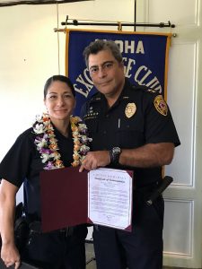 South Hilo Patrol Officer Amy Omaya receives the Officer of the Month award from Assistant Chief Mitchell Kanehailua for February 2019.