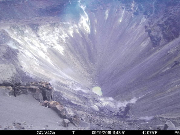 This image is from a temporary monitoring camera on the west rim of Kilauea Caldera. The camera is looking E towards the bottom of the newly enlarged Halemaʻumaʻu crater. The crater from left to right (roughly NNE to SSW) is approximately 1 km (0.6 mi) across. The depth of the crater in the visible image from the rim is several hundred meters.