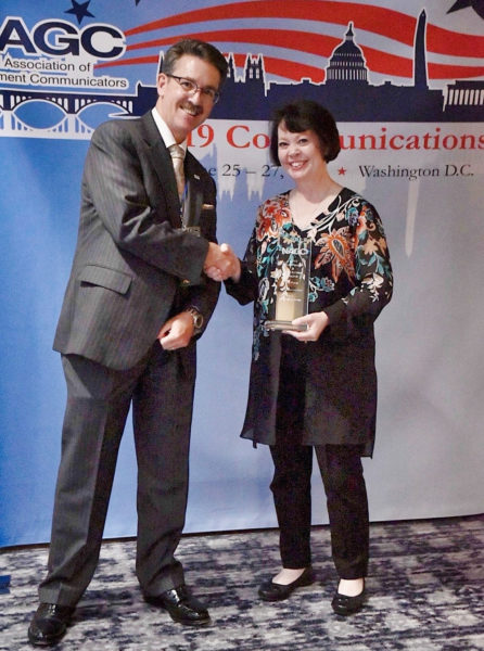 On behalf of the Hawaiian Volcano Observatory, Carolyn Donlin, Chief of the USGS Menlo Park Publishing Service Center, accepted an award from the National Association of Government Communicators recognizing HVO’s weekly “Volcano Watch” articles as excellent communication products. “Volcano Watch” received First Place in the Electronic Publication category in the 2019 NAGC Blue Pencil & Gold Screen Awards ceremony in Arlington, Virginia, in June. Photo courtesy of NAGC.