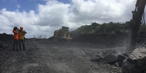 Volcano Watch: Why is the 2018 lava still so hot? Two HVO geologists document road cutting activities on HWY 132 on August 7, 2019. One geologist is taking visual photographs while another geologist is taking thermal photographs to make a tandem pair for comparison. The temperature of the solidified lava was measured to 425° C (800° F) at the digging site. Photograph by USGS geologist K. Mulliken.